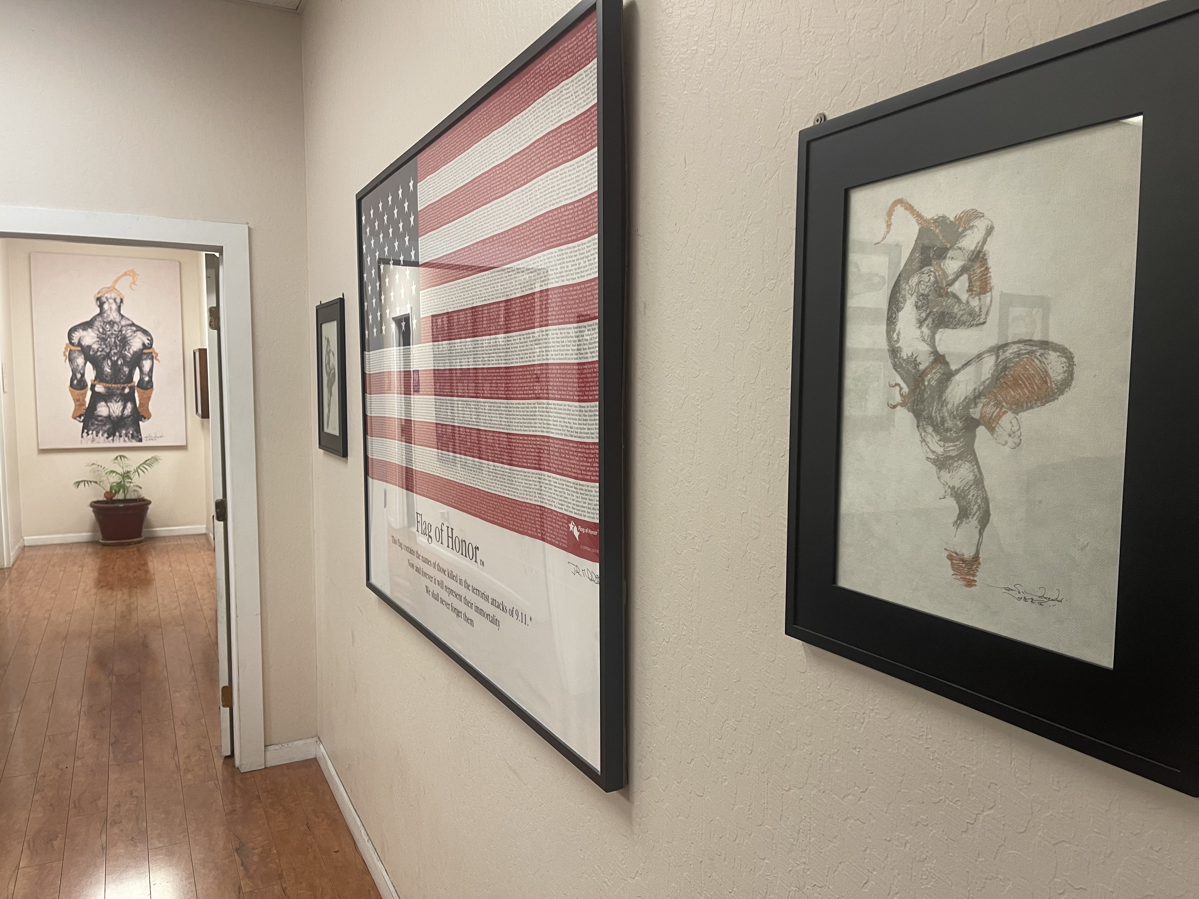Academy hallway with flag and Muay Thai artwork